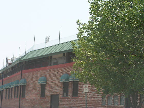 Engel Stadium's green awnings over the ticket wind